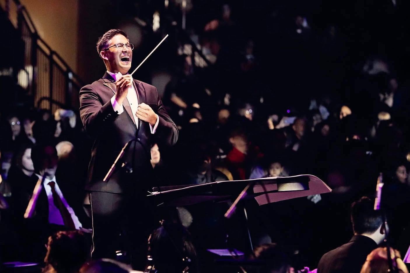Gene D. Peterson conducting in concert